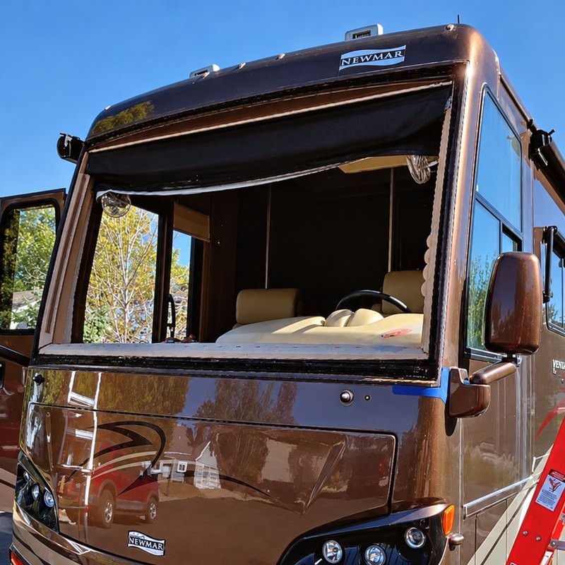 Newmar Ventana Class A motorhome with its windshield removed on a residential street